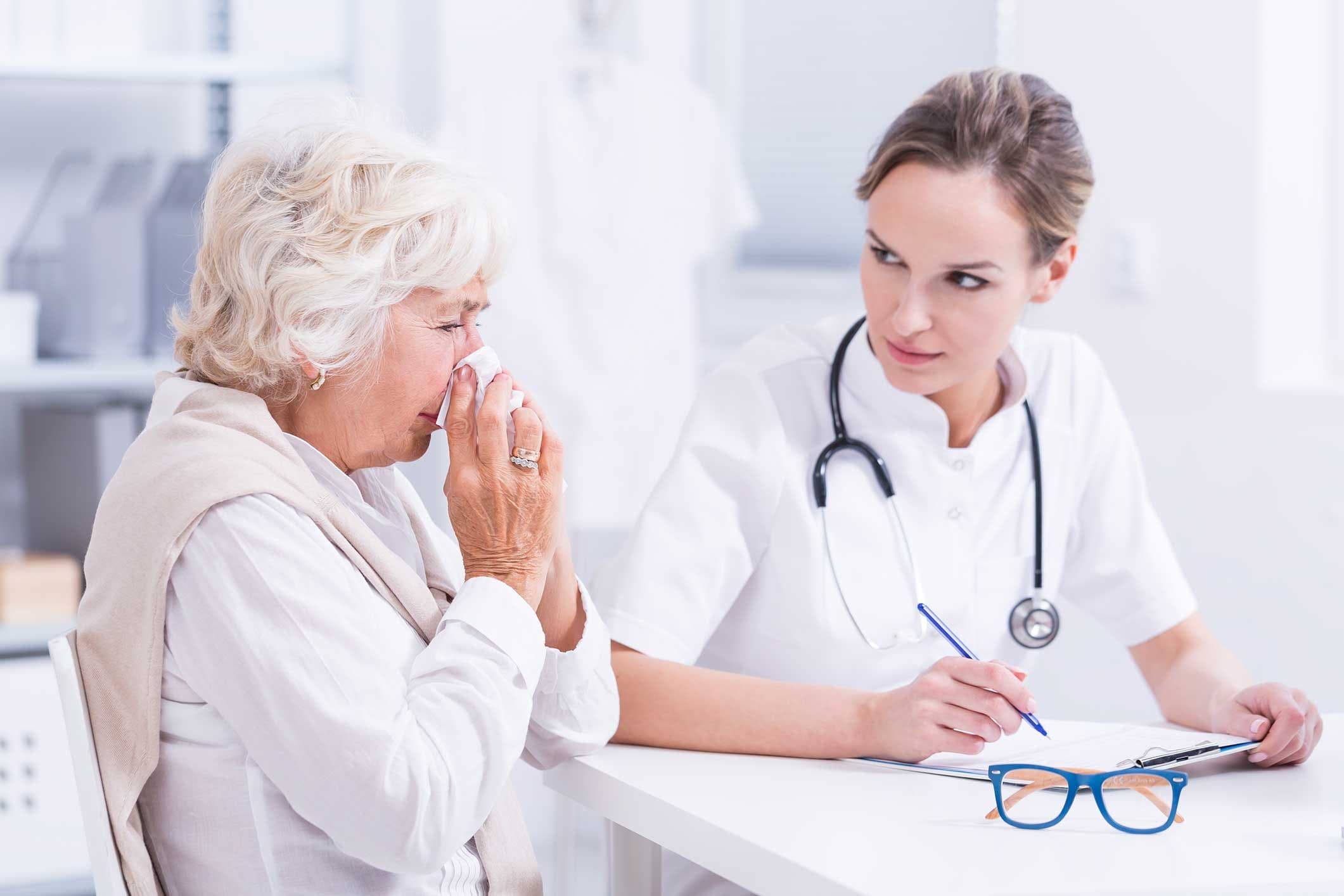 Patient discussing sinus symptoms with a physician