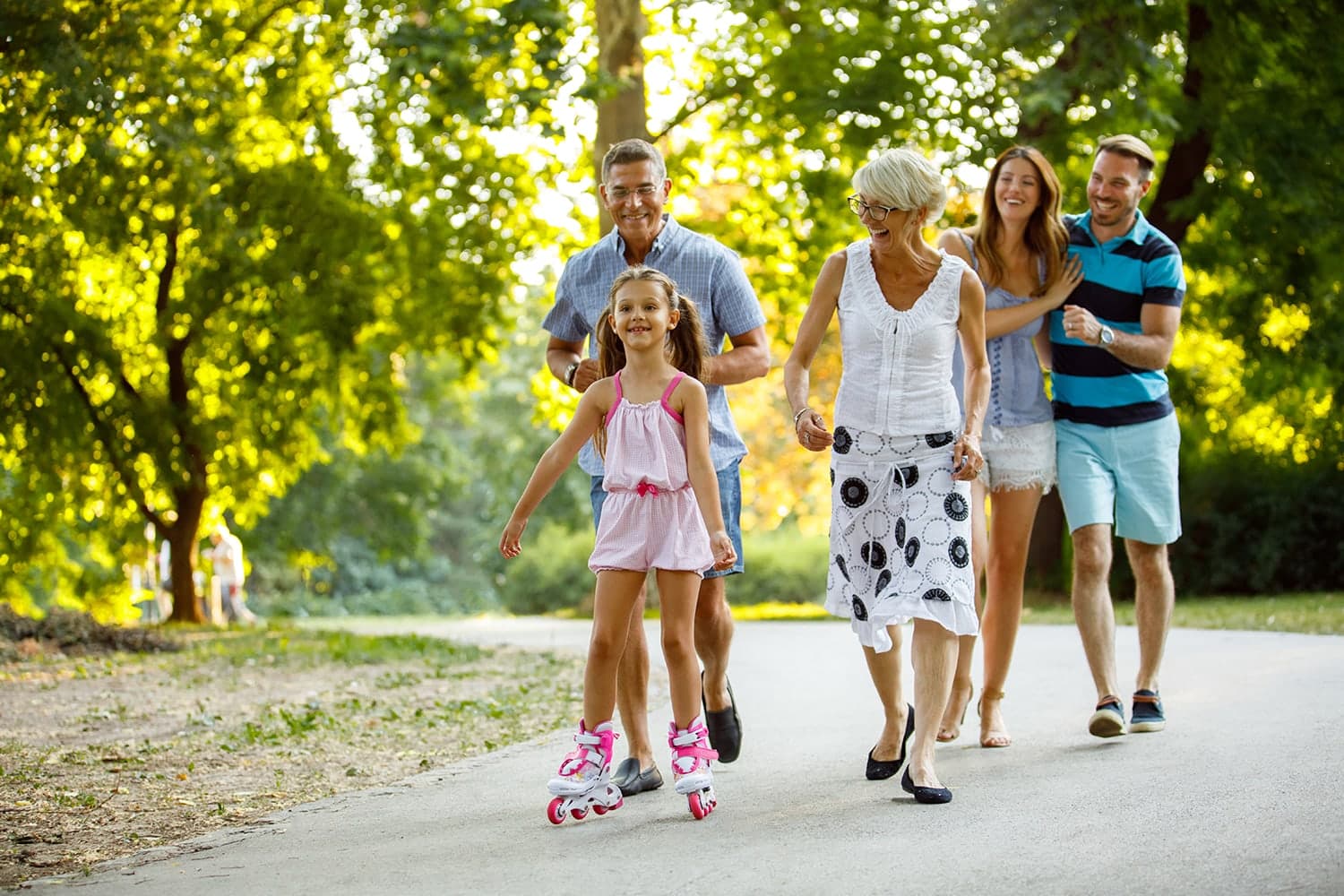 Family walking outdoors, representing improved communication with hearing support